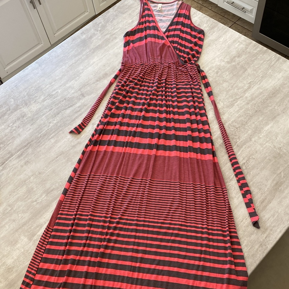 Maxi dress. Loops each side with tie. 56 inches long. Pink and dark grey.